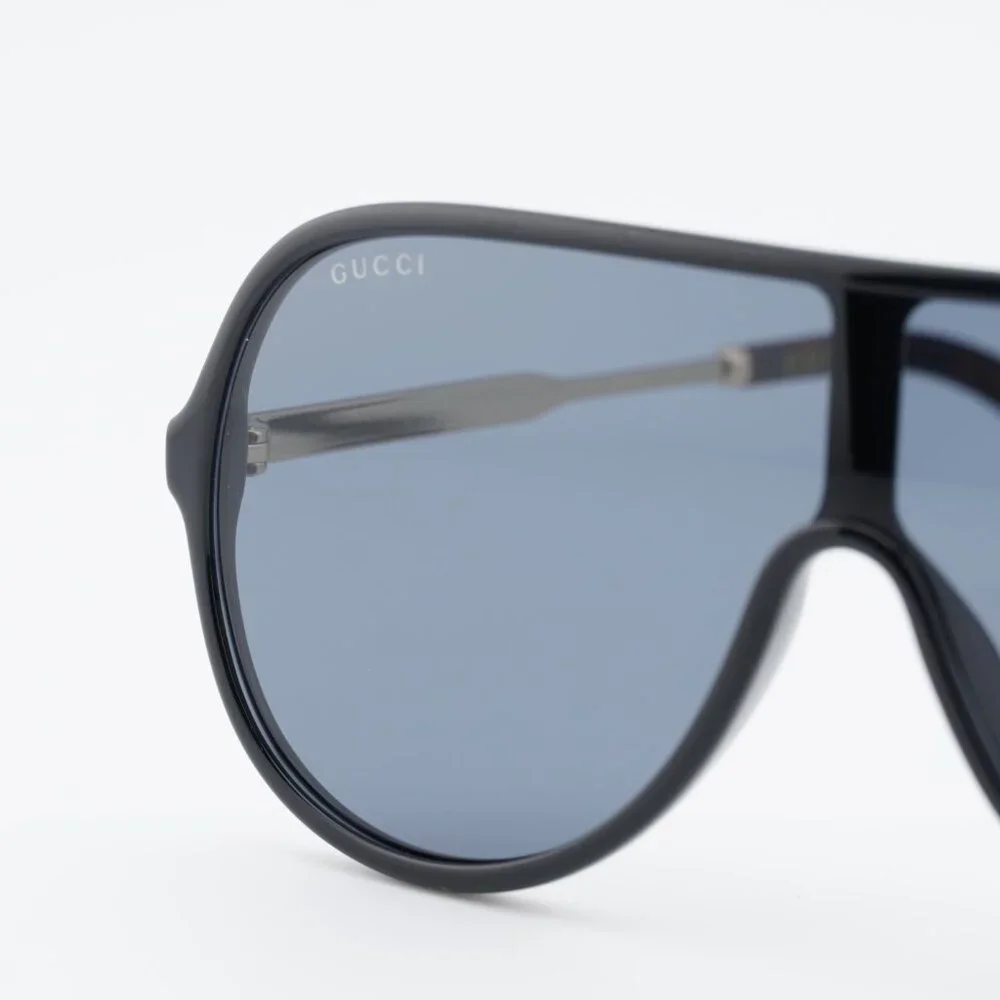 Gucci GG0199S 001 Sunglasses Shiny Black/Gold Shield Frame, Grey Lenses